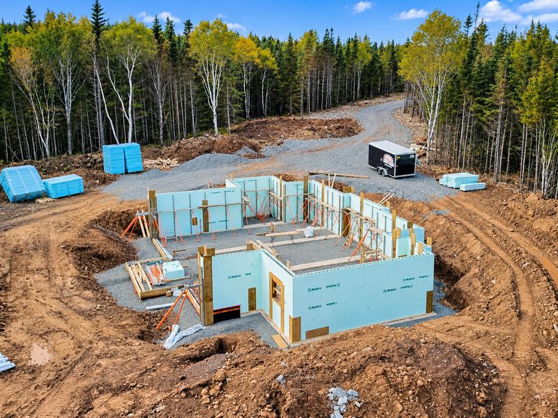 Aerial view of braced ICF foundation walls on a cleared lot, Whiteside