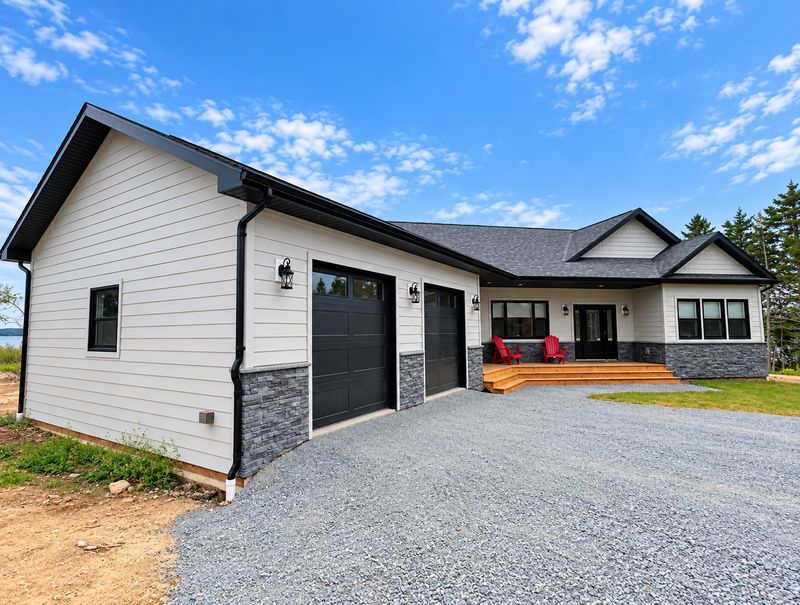 Side of a finished home and its two-car garage, Whiteside